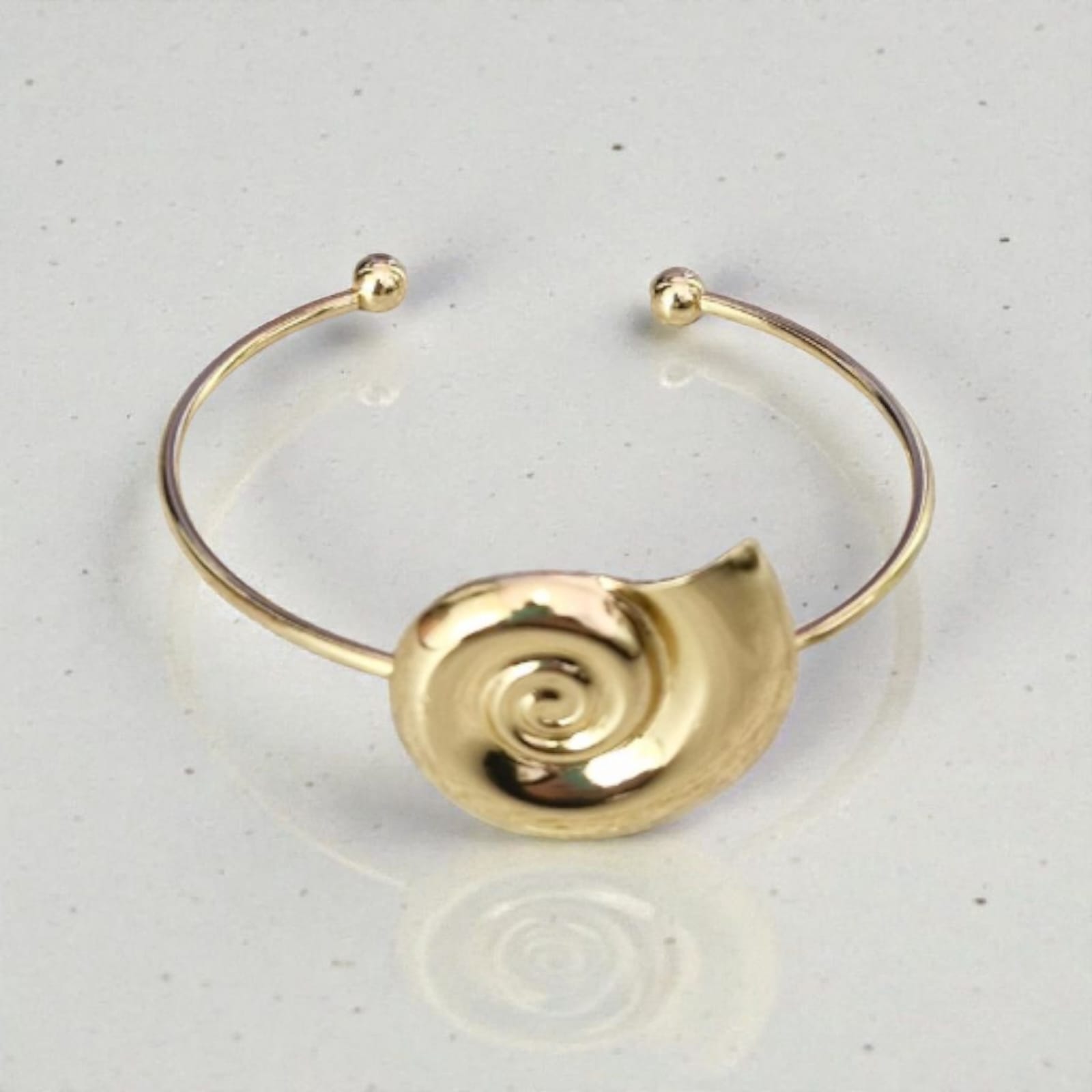 Bracelete Caracol Marinho Violeta Rio — bracelete (cuff aberto, fio fino), cor dourado, metal polido